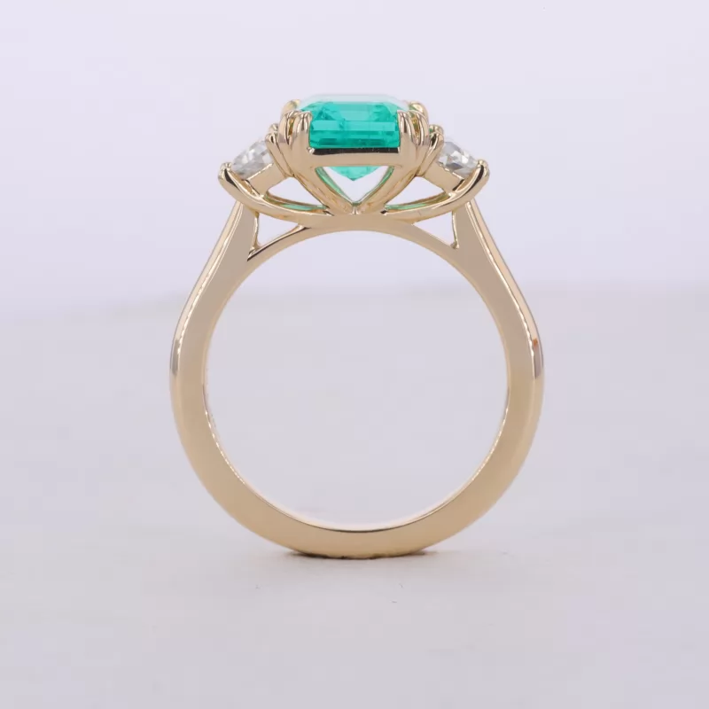 7×9mm Octagon Emerald Cut Lab Grown Emerald 9K Yellow Gold Three Stone Engagement Ring