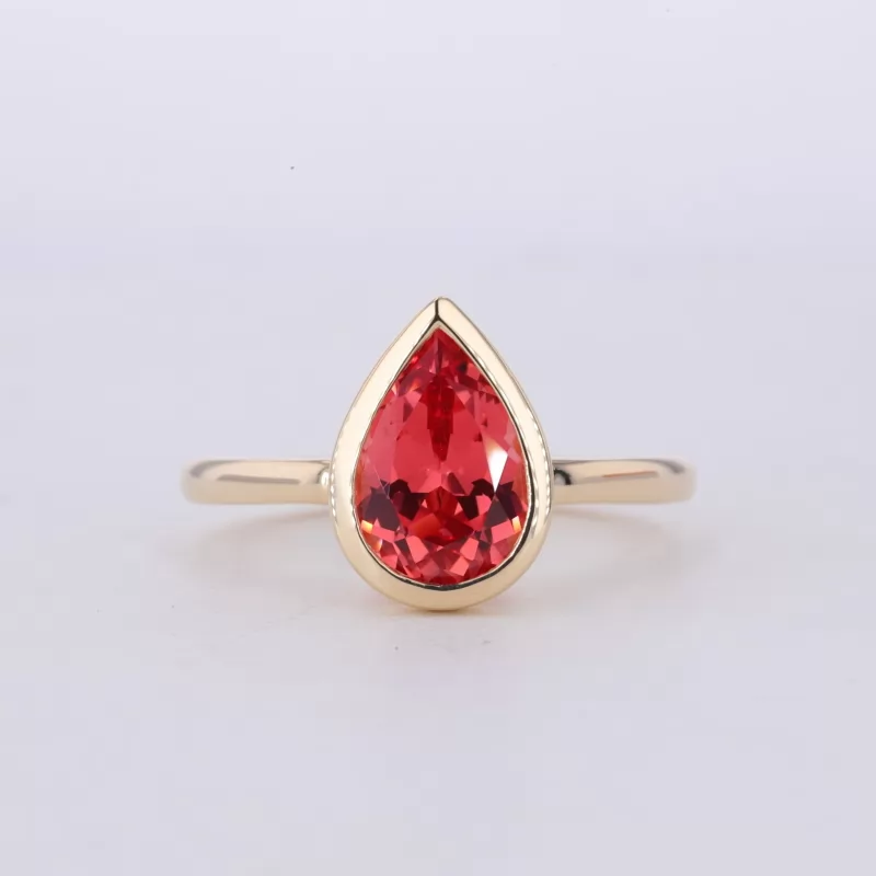 7×10mm Pear Cut Lab Grown Padparadscha Pink Sapphire Bezel Set 10K Yellow Gold Solitaire Engagement Ring