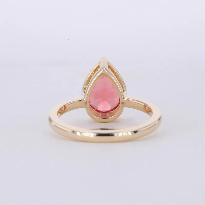 7×10mm Pear Cut Lab Grown Padparadscha Pink Sapphire Bezel Set 10K Yellow Gold Solitaire Engagement Ring