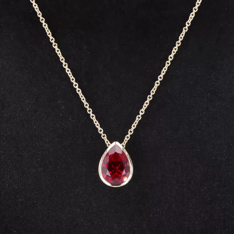8×11mm Pear Cut Lab Grown Ruby Bezel Set 10K Yellow Gold Diamond Pendant Necklace